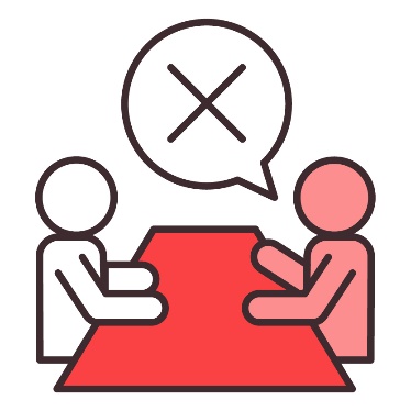 2 people sitting at a table. Above is a speech bubble showing a cross.